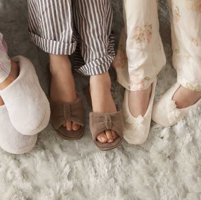 close up of three women in slippers