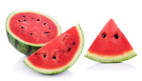 close up of watermelon slice against white background