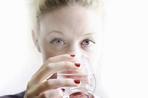 Close up of woman drinking glass of wine