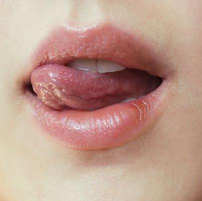 close up of woman licking lips royalty 