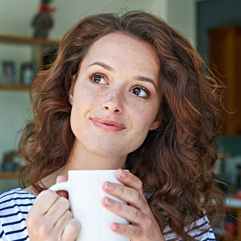 close up of woman with mug