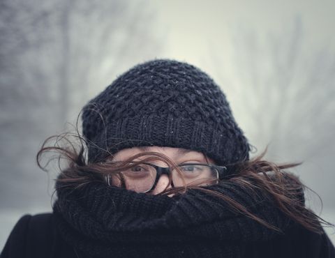 close up portrait of woman wearing warm clothing during winter