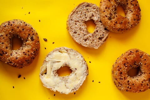 Closeup of a 12 grain bagel with butter