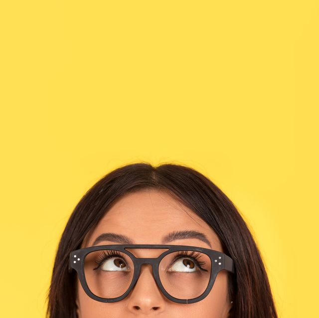 closeup portrait headshot cute happy woman in glasses looking up