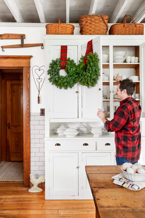 wreaths hanging from plaid ribbons