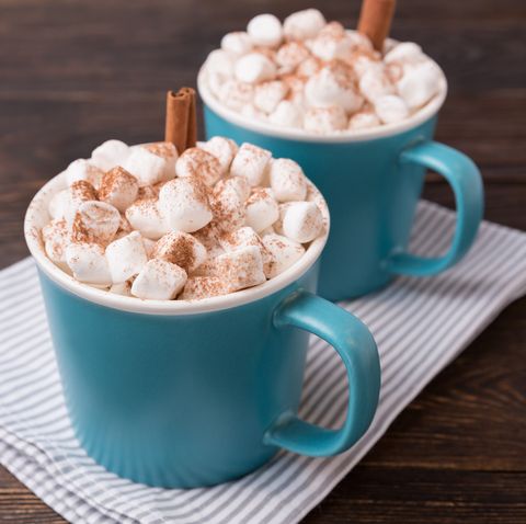 cocoa with marshmallows on brown wooden background