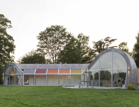 cocoon shaped house with rainbow panels