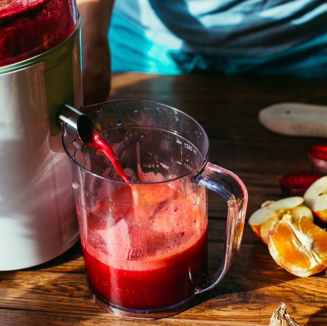 cold press juicer with oranges lemons and beets