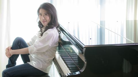 Pianist, Recital, Musician, Sitting, Musical instrument, Technology, Piano, Electronic device, Digital piano, Black hair, 