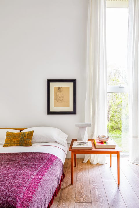 bedroom with pink throw blanket