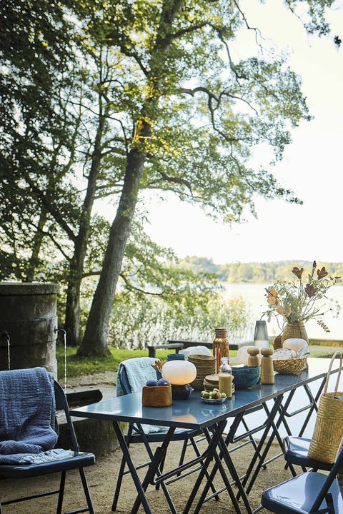 muebles de jardín comedor plegable azul en el jardín