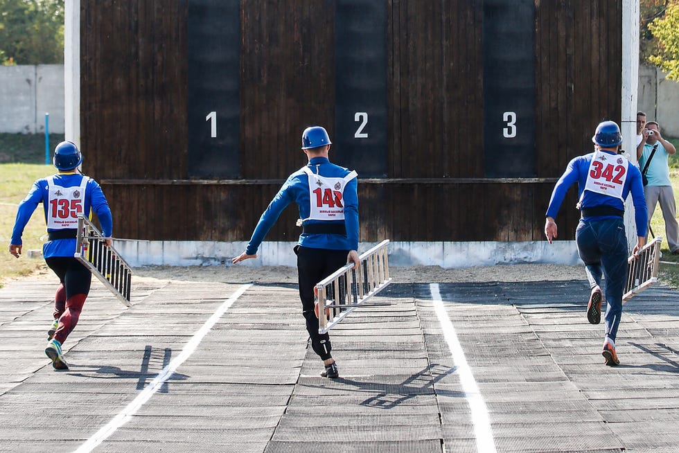 competitors-carry-assault-ladders-as-he-takes-part-in-an-news-photo-1582804312.jpg