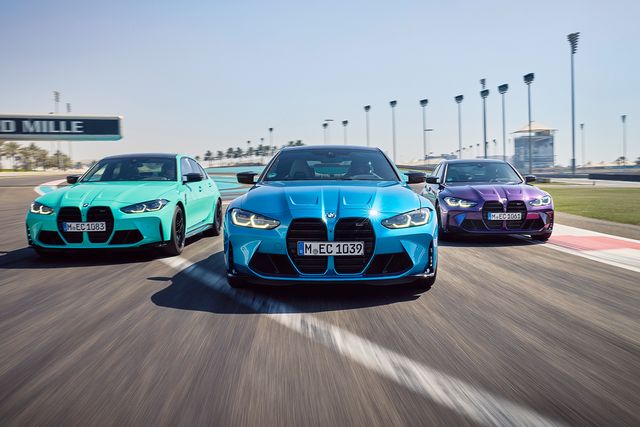 three bmw cars on a racetrack