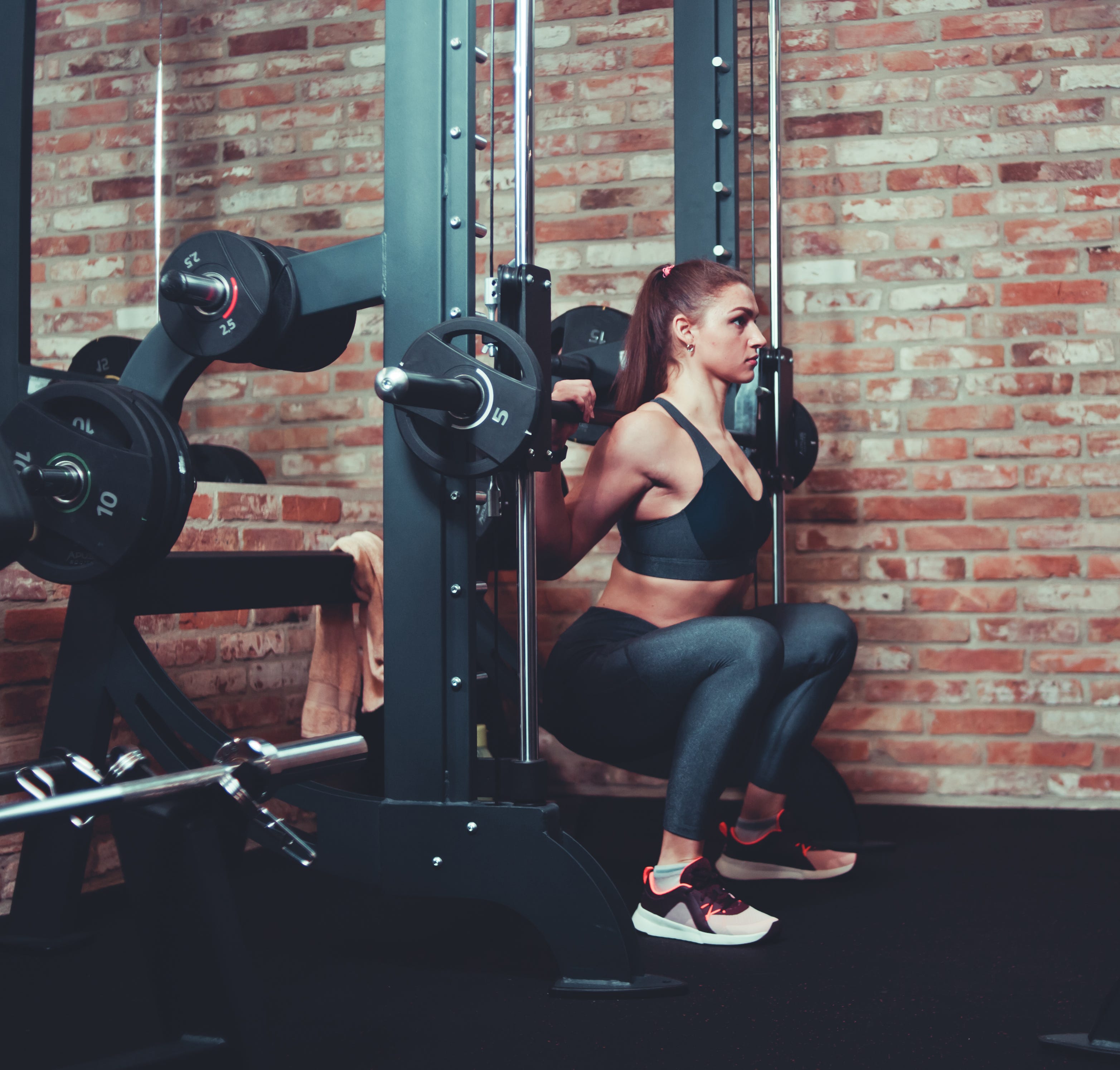 Smith Machines May Look Intimidating, But They Boast Some Serious Benefits for Runners