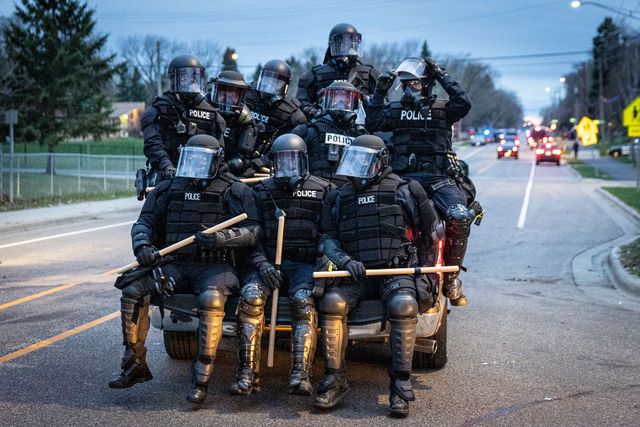 minneapolis police officers in riot gear leave as protesters gather after an officer shot and killed a black man in brooklyn center, minneapolis, minnesota on april 11, 2021   protests broke out april 11, 2021 night after us police fatally shot a young black man in a suburb of minneapolis    where a former police officer is currently on trial for the murder of george floyd hundreds of people gathered outside the police station in brooklyn center, northwest of minneapolis police fired teargas and flash bangs at the demonstrators, according to an afp videojournalist at the scene photo by kerem yucel  afp photo by kerem yucelafp via getty images