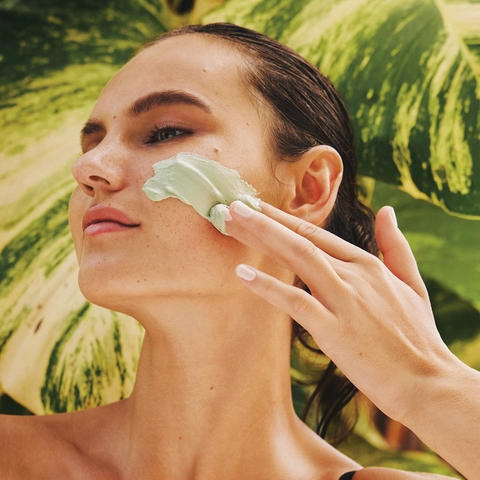 woman applying face mask