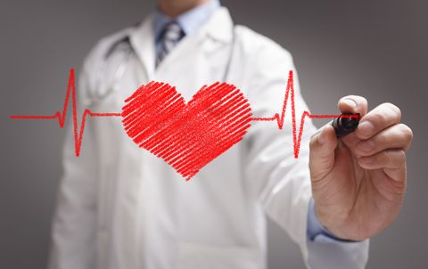 Doctor drawing ecg heartbeat chart