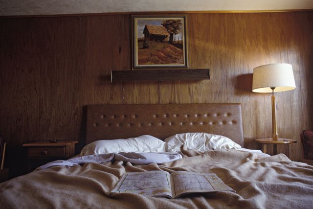 an open road atlas lies on a bed in a motel room in new mexico photo by james leynsecorbis via getty images