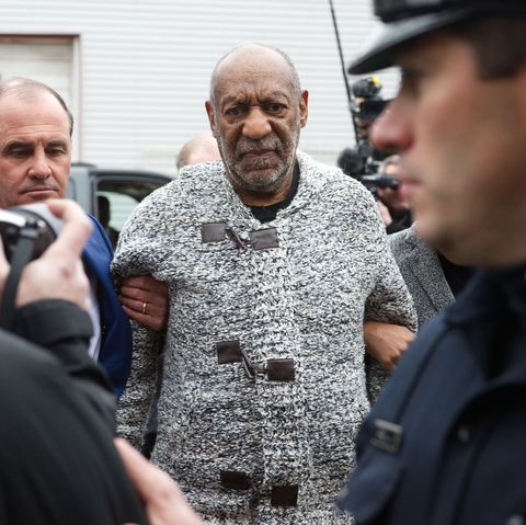 cosby in a grey sweater being arrested