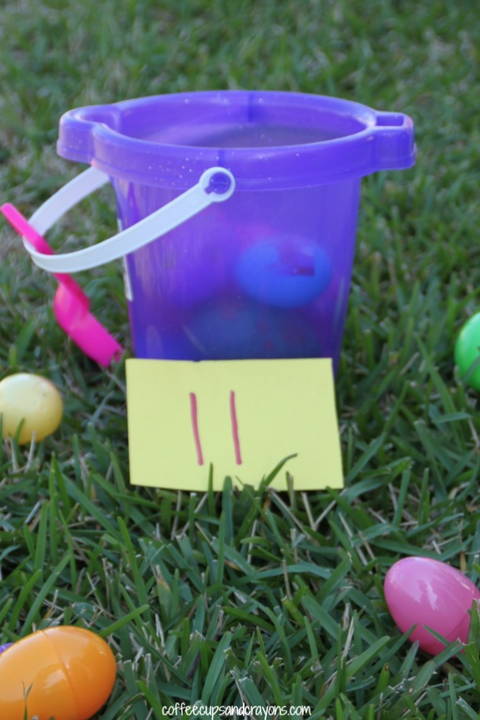 bucket with 11 eggs made of plastic in it