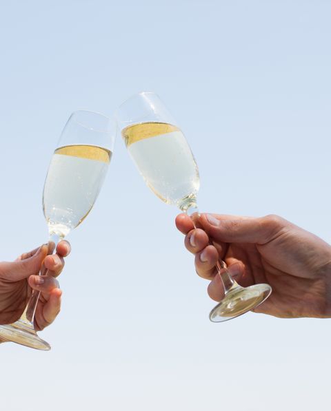 couple drinking champagne and toasting