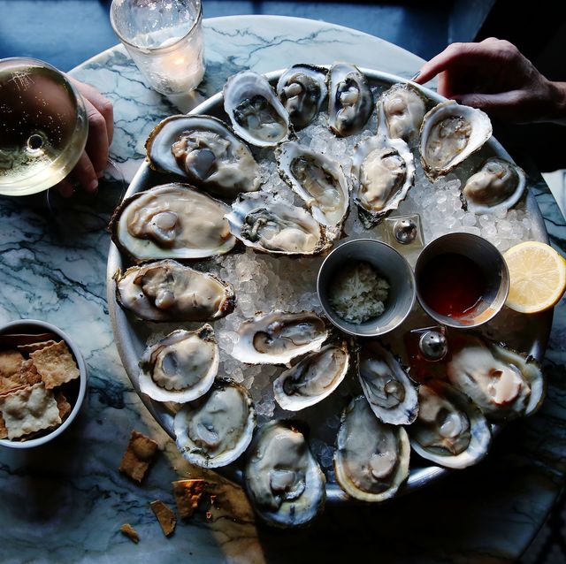 a couple enjoying raw oysters
