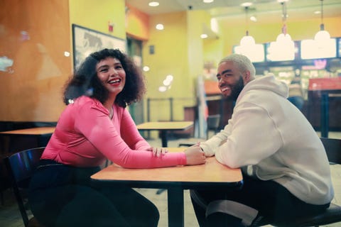 a couple sitting at a table