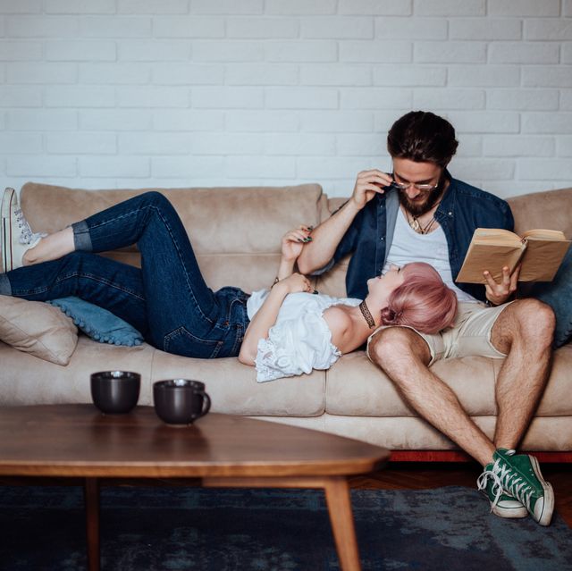 couple hanging out with each other reading book