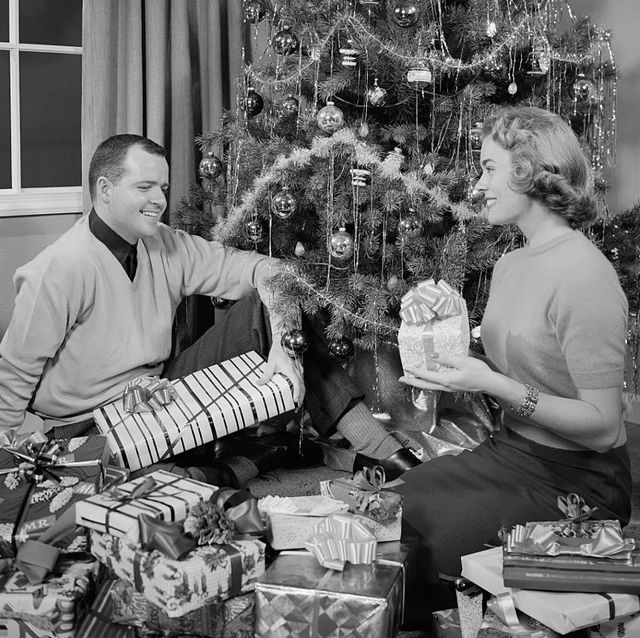 couple holding christmas gifts