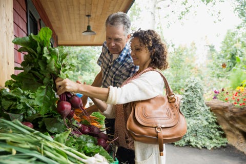 Couple shopping for beets outside market