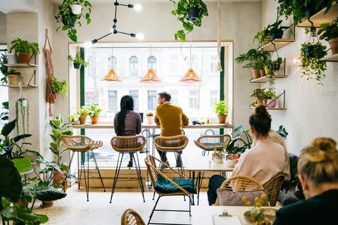 couple sitting in front of window in quirky café