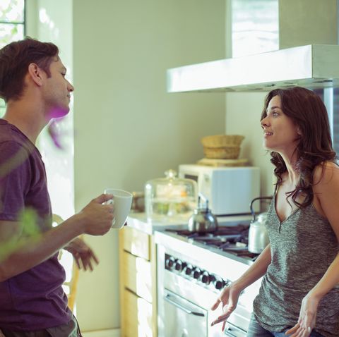 couple talking in kitchen