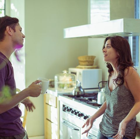 couple talking in kitchen
