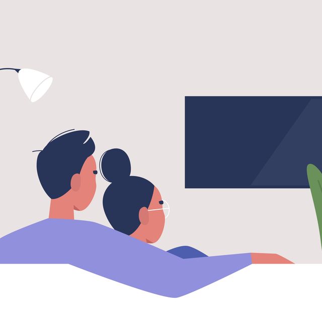 a couple watching tv at home, weekend relaxation, modern lifestyle