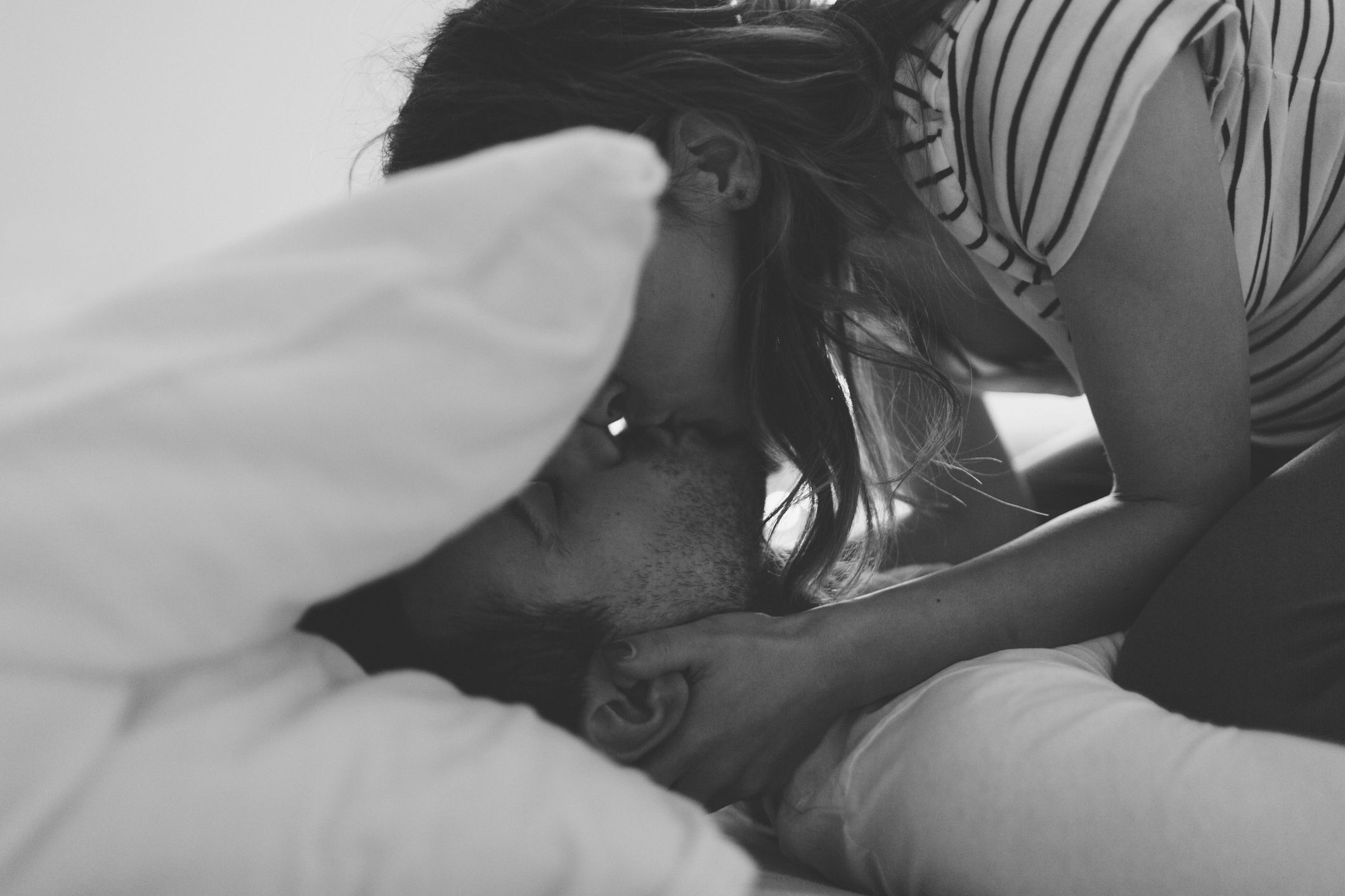 How to be on top of a guy in bed Love Story Man And Woman Lie In Bed Hug Each Other And Laugh Happiness Couple Morning Bed Top View Black And White Photo Stock Photo Adobe Stock