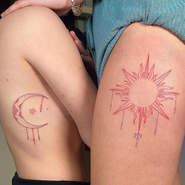 couple tattoo of 1111 written out, torso moon tattoo with tattoo of sun on thigh in red ink