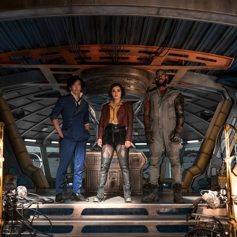 cowboy bebop l to r john cho as spike spiegel, daniella pineda as faye valentine, and mustafa shakir as jet black of cowboy bebop cr geoffrey shortnetflix © 2021