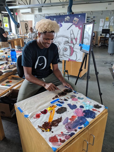 student painting in art studio