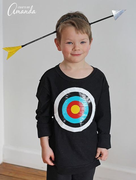 little boy wearing bullseye shirt with fake arrow through head
