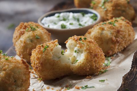 creamy mashed potato croquettes with cheese and sour cream dip