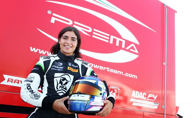 british race car driver, jamie chadwick, poses in her racing gear