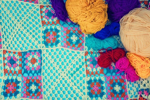 crochet handmade colorful blanket and some balls of yard