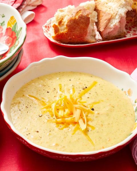 broccoli cheese soup with bread in back