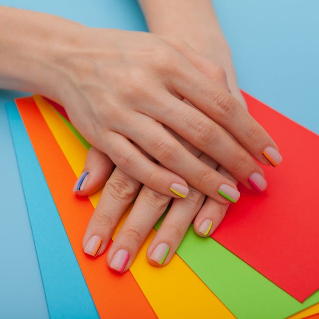 Cropped Hands On Colorful Papers cropped hands on colorful papers