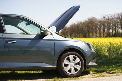 Cropped image of broken down car on roadside