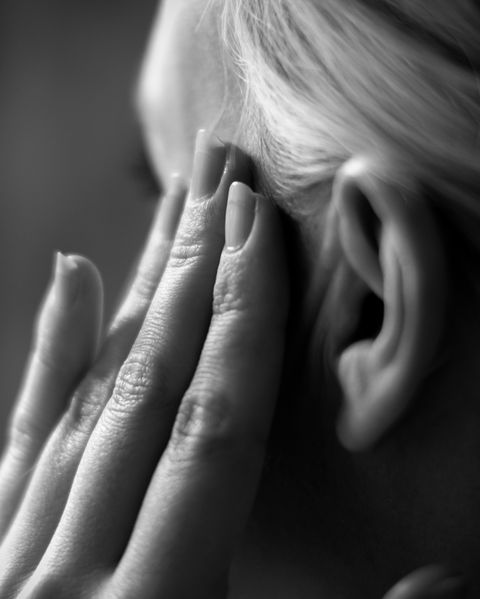 Cropped Image Of Woman Suffering From Headache