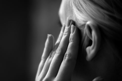 Cropped Image Of Woman Suffering From Headache