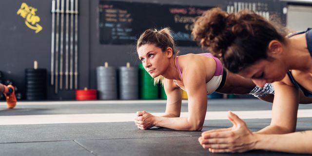 cropped view of women in gym planking royalty free image 961177920
