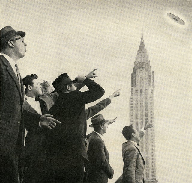 crowd pointing at ufo