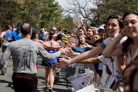 Crowds Gather Along Route of Boston Marathon To Cheer On Runners